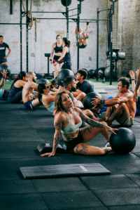 A group of people working out together in a gym fitness class