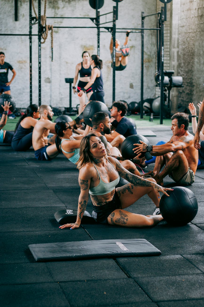 A group of people working out together in a gym fitness class